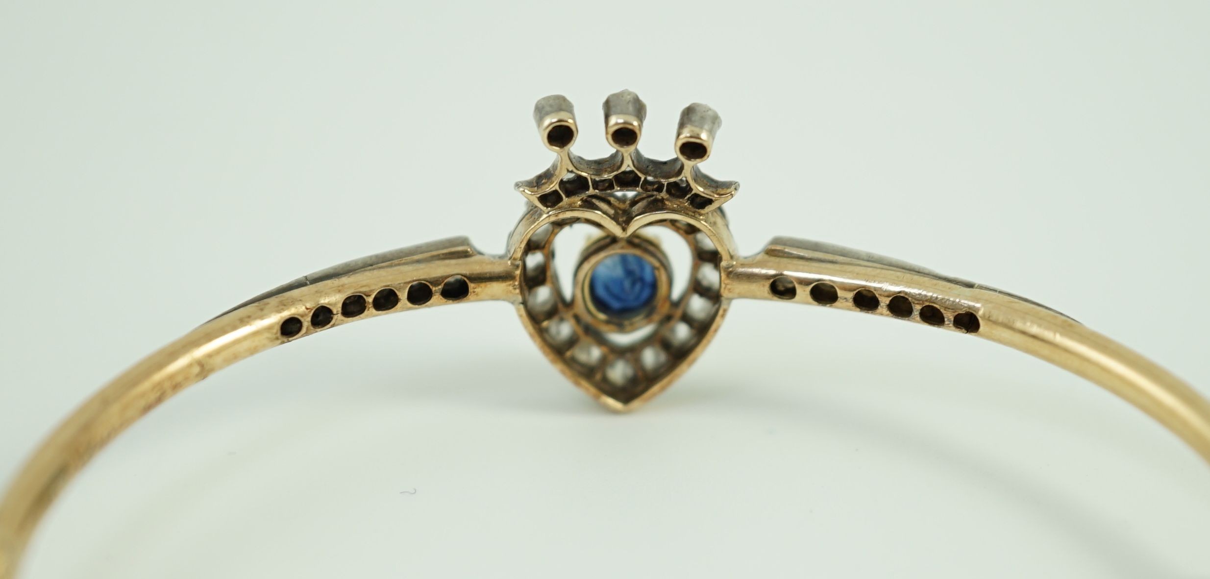 A 19th century gold, sapphire and rose cut diamond set hinged bangle